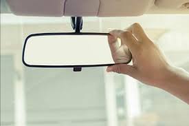 adjusting rear view mirror