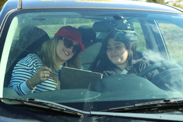 2020 Driving School instructor reviewing a student's driving skills